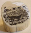 Walluk scrimshaw of seal on ice floe and Eskimo driving a team of sled dogs